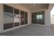 Covered patio with multiple sliding glass doors leading to interior, perfect for outdoor living at 40165 N Alameda Dr, San Tan Valley, AZ 85140