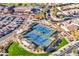 Aerial view of community amenities including tennis courts, pool, putting greens, and clubhouse at 4214 E Donato Dr, Gilbert, AZ 85298