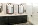 Bathroom features double sinks, framed mirrors, vanity, and walk-in shower at 4214 E Donato Dr, Gilbert, AZ 85298