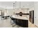 Kitchen with large island, pendant lighting and stainless steel appliances at 4214 E Donato Dr, Gilbert, AZ 85298