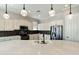 Charming kitchen features white cabinets, stainless steel appliances, and unique backsplash tiles at 4214 E Donato Dr, Gilbert, AZ 85298