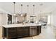 Open concept floorplan with island kitchen, living room, and dining area at 4214 E Donato Dr, Gilbert, AZ 85298