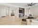 Spacious living room featuring wood floors, neutral colors, ceiling fan and open floor plan at 4214 E Donato Dr, Gilbert, AZ 85298