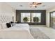 Main bedroom featuring neutral color palette, carpet, and patio access at 4214 E Donato Dr, Gilbert, AZ 85298