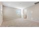 Serene bedroom with soft carpeting, abundant natural light, and a view into the ensuite bathroom at 5850 E Ringtail Way, Phoenix, AZ 85054
