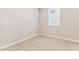 This bedroom features neutral carpeting, a window, and is freshly painted in a neutral color at 5850 E Ringtail Way, Phoenix, AZ 85054