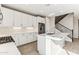 Modern kitchen with white cabinets, stainless steel appliances, and quartz countertops offers style and functionality at 5850 E Ringtail Way, Phoenix, AZ 85054