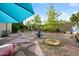Unique backyard featuring decorative stone, gravel, and whimsical decorations to create a serene space at 7042 N 12Th Way, Phoenix, AZ 85020
