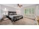 Comfortable bedroom with shutters and a ceiling fan at 7042 N 12Th Way, Phoenix, AZ 85020