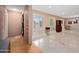 Inviting foyer showcases elegant marble flooring, plantation shutters, and decorative furnishings at 7042 N 12Th Way, Phoenix, AZ 85020