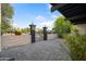 Eye-catching front yard with decorative stone and brick, pavers, front gate, and stylish landscaping around the property at 7042 N 12Th Way, Phoenix, AZ 85020