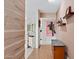 Hallway showcasing wood floors, decorative shelving, and art pieces at 7042 N 12Th Way, Phoenix, AZ 85020