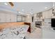 Bright kitchen boasts granite counters, stainless steel appliances, and an island with seating at 7042 N 12Th Way, Phoenix, AZ 85020