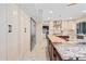 Well-lit kitchen featuring granite counters, stainless steel appliances, and ample storage space at 7042 N 12Th Way, Phoenix, AZ 85020