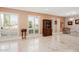 Spacious living room with shuttered windows and elegant furniture, offering a bright and airy atmosphere at 7042 N 12Th Way, Phoenix, AZ 85020