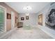 Bright living room with marble floors, neutral walls, recessed lighting, art and a round glass table at 7042 N 12Th Way, Phoenix, AZ 85020