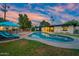 Beautiful backyard pool area with a patio, lounge chairs, and lush greenery, perfect for outdoor enjoyment at 7042 N 12Th Way, Phoenix, AZ 85020