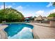 Sparkling swimming pool with lounge chairs, outdoor dining, and a built-in barbecue area for entertaining at 7042 N 12Th Way, Phoenix, AZ 85020