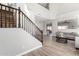 Bright, open-concept living room with wood floors and staircase at 706 W Green Tree Dr, San Tan Valley, AZ 85143