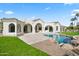 Resort-style backyard featuring a pool, spacious patio, and manicured landscaping at 7157 E Bronco Dr, Paradise Valley, AZ 85253