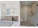 Contemporary bathroom featuring a glass-enclosed shower with marble tile and modern fixtures at 7157 E Bronco Dr, Paradise Valley, AZ 85253