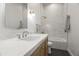 Stylish bathroom with a marble countertop, subway tile backsplash, and modern lighting fixtures at 7157 E Bronco Dr, Paradise Valley, AZ 85253