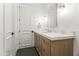 Chic bathroom featuring a marble countertop, wood vanity, and dark-tiled floors at 7157 E Bronco Dr, Paradise Valley, AZ 85253