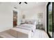 Inviting bedroom with ensuite bathroom, natural light, and a calming neutral color palette at 7157 E Bronco Dr, Paradise Valley, AZ 85253