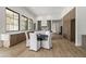 Bright dining area with wood floors, a round table with seating, and built in cabinets at 7157 E Bronco Dr, Paradise Valley, AZ 85253