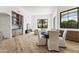 Bright dining area featuring wood floors, a round table with seating, and views to outdoor patio at 7157 E Bronco Dr, Paradise Valley, AZ 85253