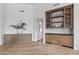Open dining area featuring wood floors, a built-in bar with glass display shelves and cabinets at 7157 E Bronco Dr, Paradise Valley, AZ 85253