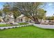Stunning home boasts a well-manicured front yard, mature trees, and a welcoming walkway at 7157 E Bronco Dr, Paradise Valley, AZ 85253