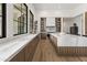 Bright, expansive kitchen with custom cabinets, marble countertops, and modern appliances at 7157 E Bronco Dr, Paradise Valley, AZ 85253