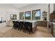 Spacious kitchen boasts an island with seating, stainless steel appliances, and natural light at 7157 E Bronco Dr, Paradise Valley, AZ 85253