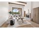 Open living space with a fireplace, modern furnishings, and sliding glass doors to the backyard at 7157 E Bronco Dr, Paradise Valley, AZ 85253