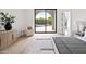 Main bedroom featuring neutral decor, sliding glass door to the backyard, and views of the swimming pool at 7157 E Bronco Dr, Paradise Valley, AZ 85253