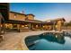 Resort-style backyard with a pool, spa, built-in grill, and covered patio at 7413 E Lower Wash Pass, Scottsdale, AZ 85266