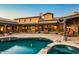 Resort-style backyard with pool, spa, covered patio, and outdoor seating at 7413 E Lower Wash Pass, Scottsdale, AZ 85266