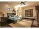 Spacious bedroom with a king-size bed, cozy rug, fireplace, and natural light at 7413 E Lower Wash Pass, Scottsdale, AZ 85266