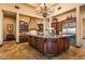 Gourmet kitchen boasting a large island, custom cabinetry, granite countertops, and luxury appliances at 7413 E Lower Wash Pass, Scottsdale, AZ 85266