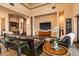 Spacious living room featuring tray ceilings, recessed lighting, and leather furniture at 7413 E Lower Wash Pass, Scottsdale, AZ 85266