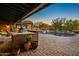 Outdoor patio featuring a built-in grill and a pool, perfect for outdoor entertaining and enjoying the backyard at 7413 E Lower Wash Pass, Scottsdale, AZ 85266