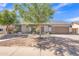 Charming single-story home with a well-manicured yard and a two-car garage at 8049 E Des Moines St, Mesa, AZ 85207