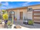 Charming front porch with seating area, stylish door, and decorative plants at 8049 E Des Moines St, Mesa, AZ 85207
