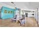 Bright open-concept living room featuring tile flooring and neutral paint colors at 8049 E Des Moines St, Mesa, AZ 85207