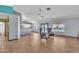 Spacious living room with tile floors, large windows, and a ceiling fan at 8049 E Des Moines St, Mesa, AZ 85207