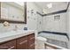 Modern bathroom with a glass-enclosed shower, contemporary fixtures, and a stylish vanity with storage at 8213 E Whitton Ave, Scottsdale, AZ 85251
