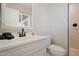Neat bathroom featuring a white vanity, toilet, shower, and window for natural light at 8213 E Whitton Ave, Scottsdale, AZ 85251