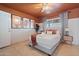 Comfortable bedroom featuring cactus artwork, a ceiling fan, and a neatly made bed with bedside tables at 8213 E Whitton Ave, Scottsdale, AZ 85251