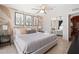 Inviting bedroom with cactus-themed decor, mirrored closet, and a plush bed with decorative pillows at 8213 E Whitton Ave, Scottsdale, AZ 85251